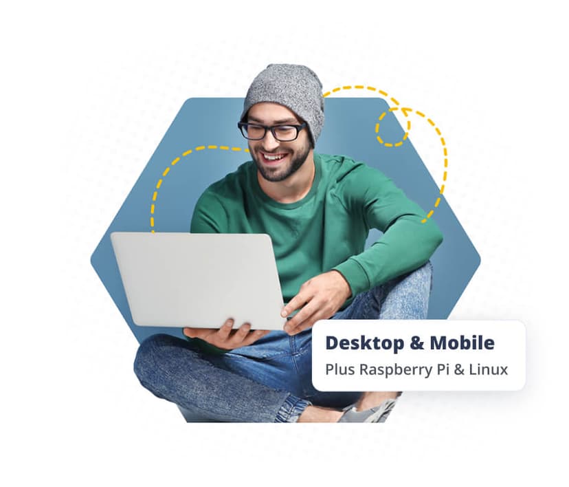 Man using laptop and phone